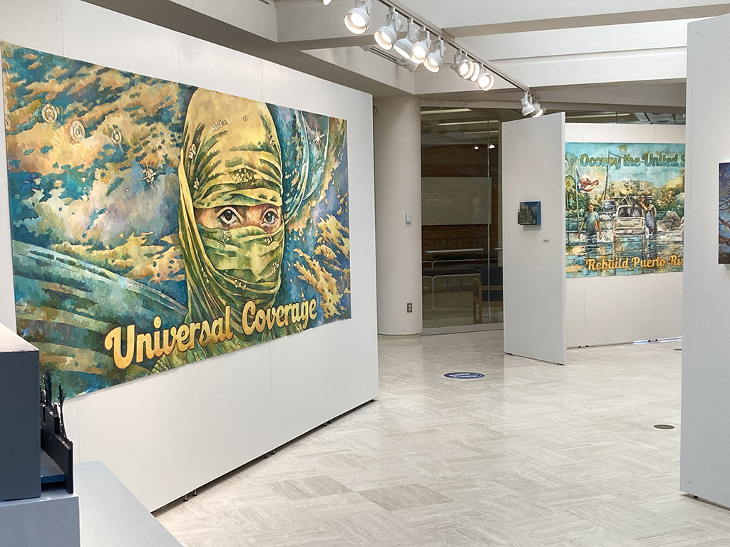 installation view looking toward door way- billboard, small relief painting, billboard, small painting